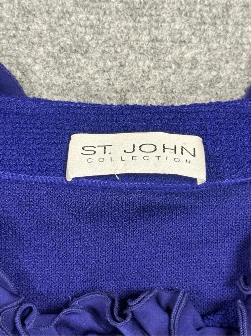 St. John Collection Blue knit skirt suit features a jacket Size 12